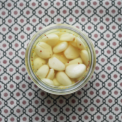 Garlic cloves in a tulip jar